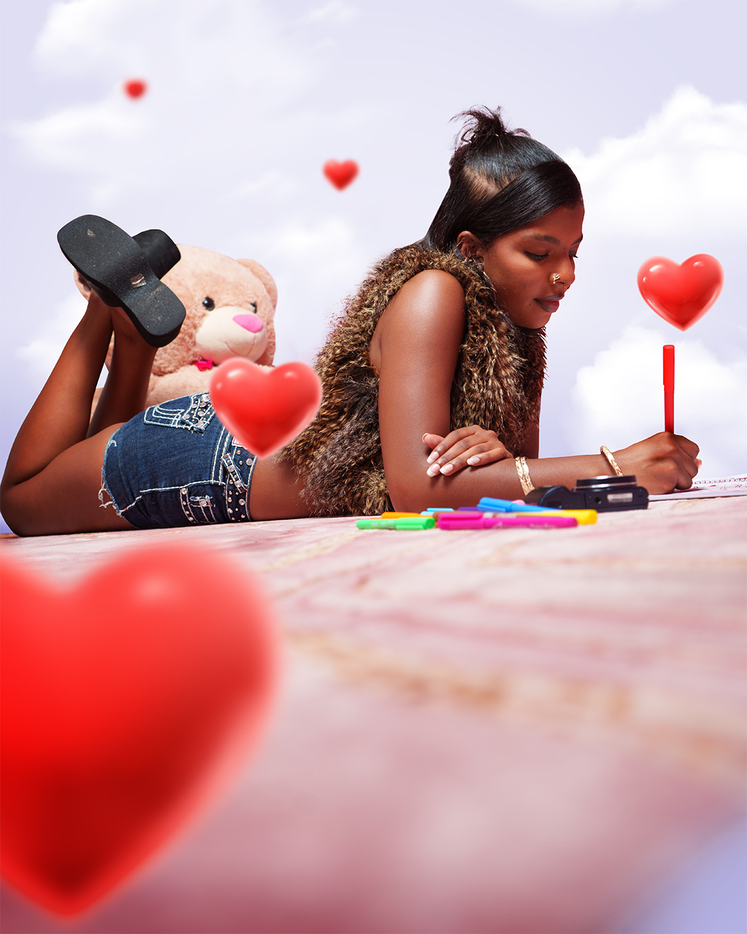 black woman laying on the ground with red hearts flying around her